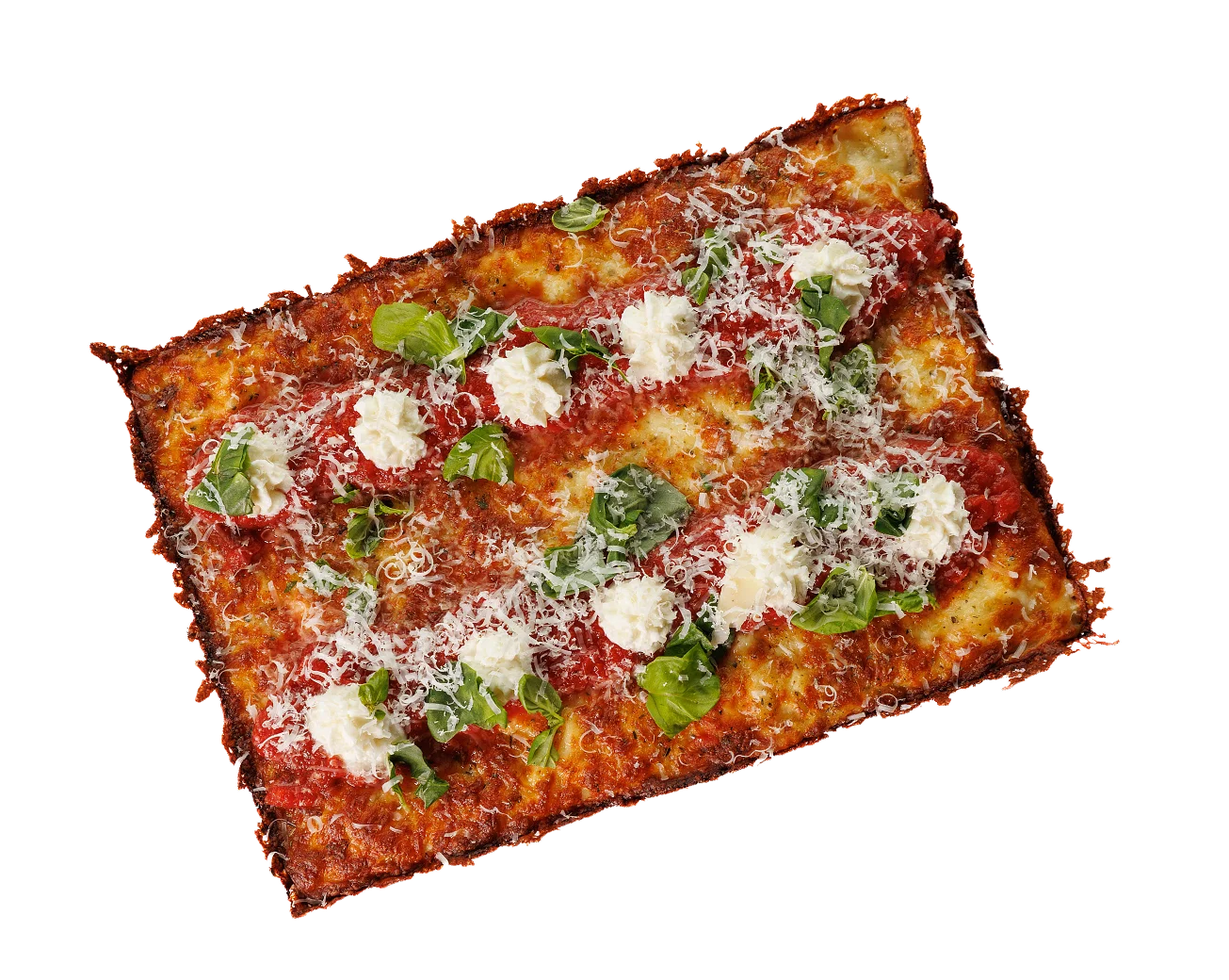 A freshly baked Detroit style pizza with crispy edges, tomato sauce, dollops of ricotta, and basil leaves